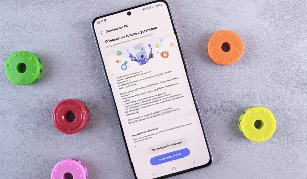 Flat Lay of Smartphone with Vibrant Accessories on Desk
